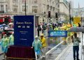 反迫害 傳真相 英國法輪功學員紀念7.20二十六周年風雨無阻